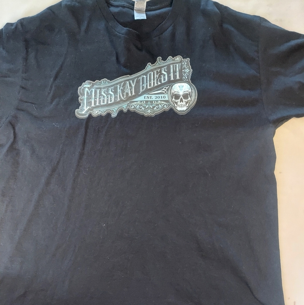 The Gildan Men's Size XL T-Shirt features a design called "Miss Kay Does It," .